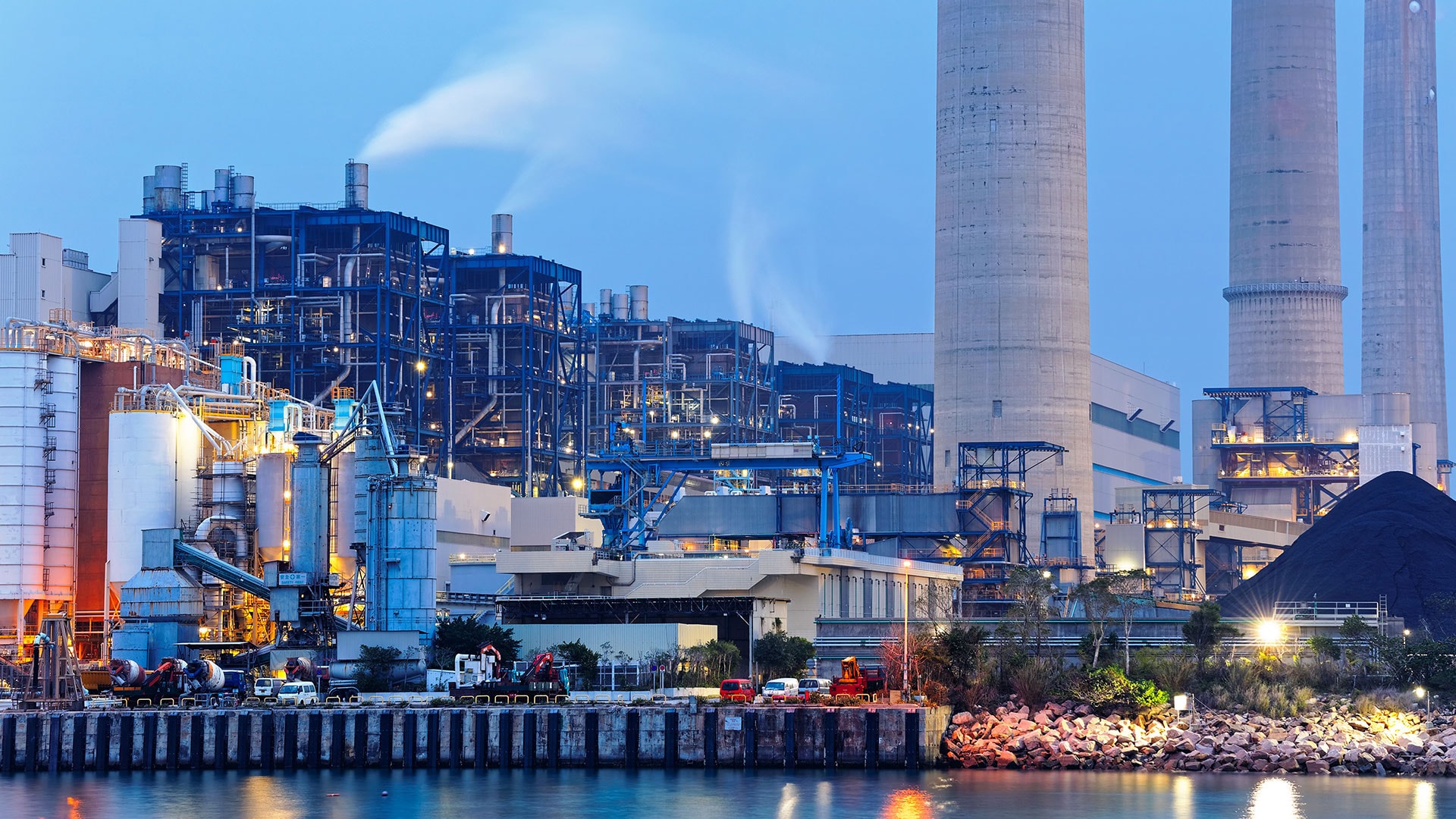 Industrial energy and process facility at dusk